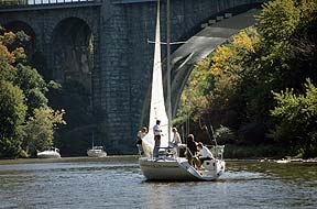 Sailboat in the river near the Veterans Memorial bridge.