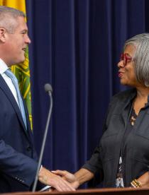 Photo for DRHS Commissioner Shirley Green shaking hands with Monroe County Executive Adam Bello.