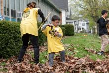 Photo of a child raking leaves during Clean Sweep 2024.