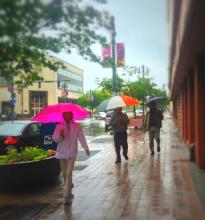 Rain on downtown sidewalk