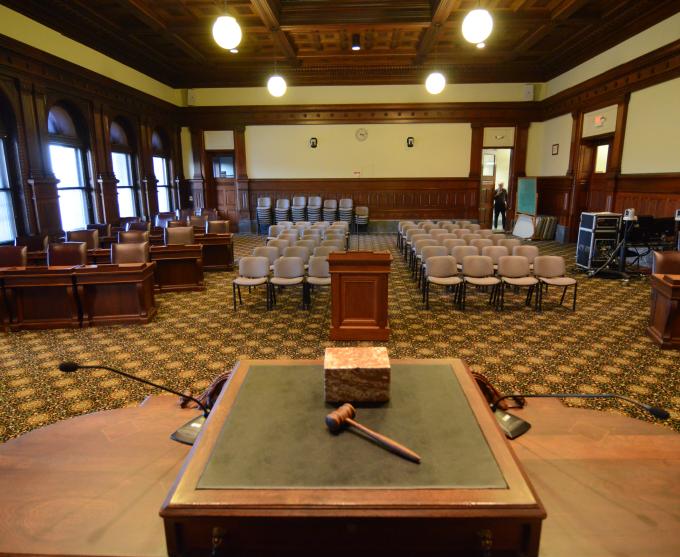 Photograph of a gavel on a desk inside Rochester City Council Chambers.