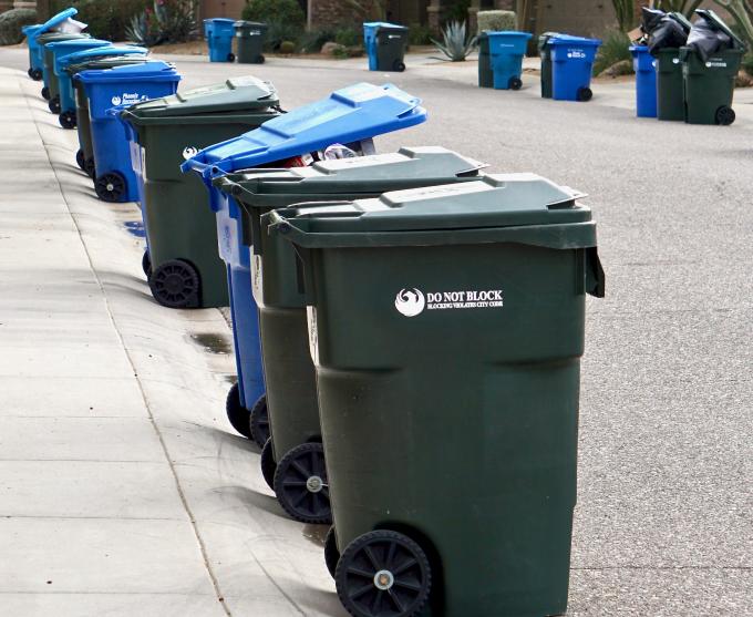 Photograph of residential garbage cans.