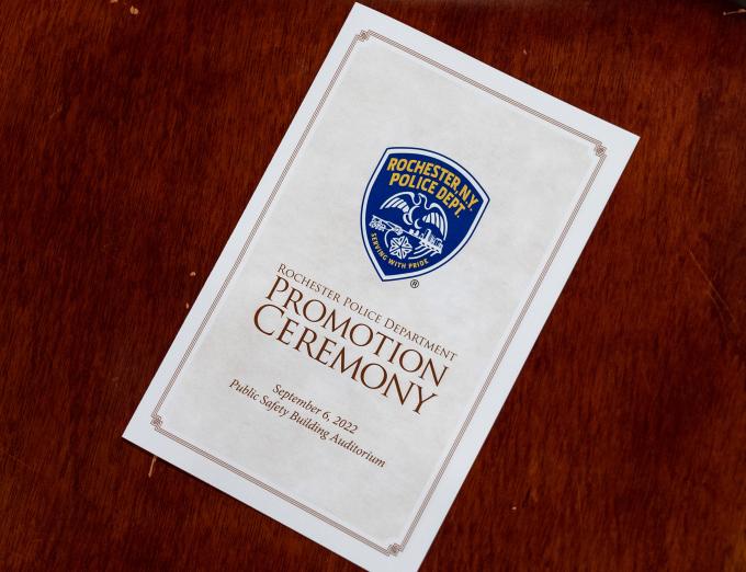 Photograph of a program for a Rochester Police Department promotion ceremony.