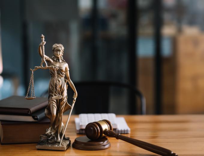 Photo of a gavel on a lawyer's desk.