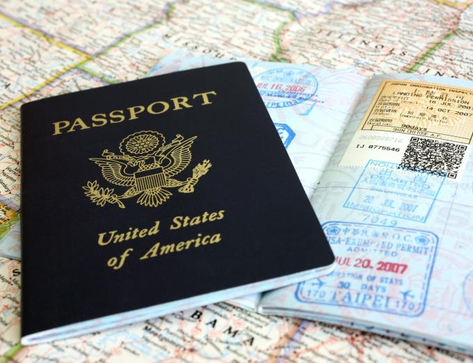 Photo of a passport on top of a map.