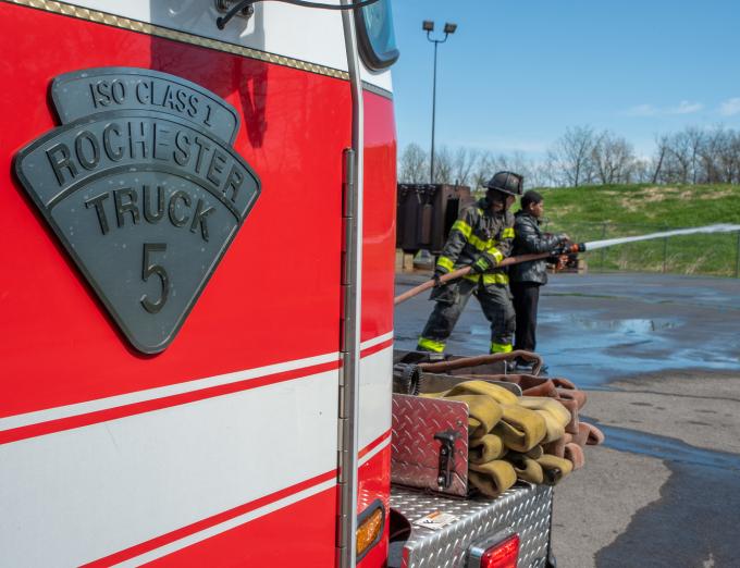 Photo of a Rochester fire truck and a a Rochester firefighter