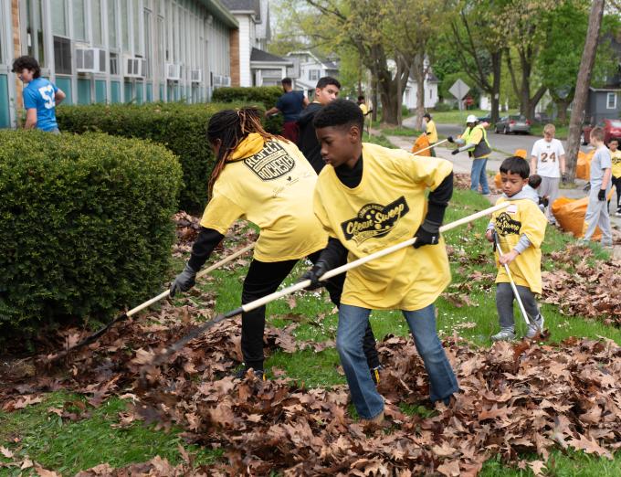 Photo of children raking leaves during Clean Sweep 2024.