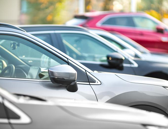 Photo of cars parked in a lot.