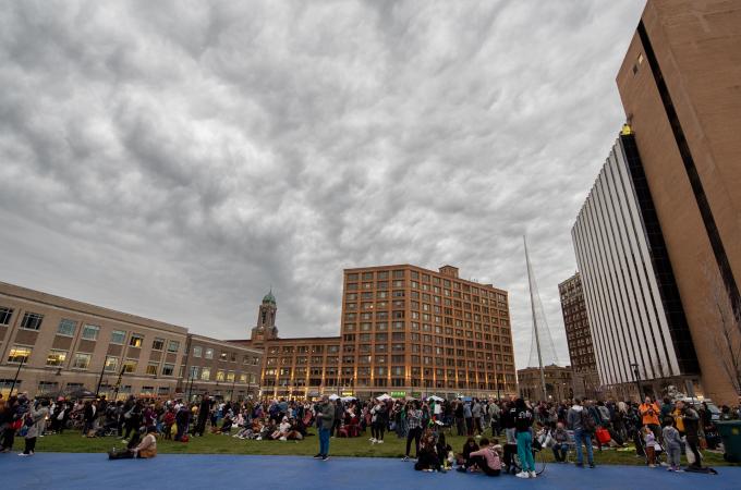 Photo of people gathered at Parcel 5 in Rochester for the total solar eclipse in April 2024.