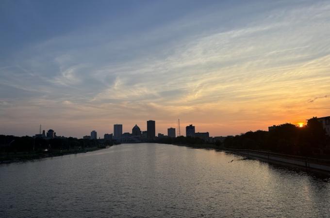 Photo of the Rochester skyline from the Ford Street bridge at sunrise in the morning.