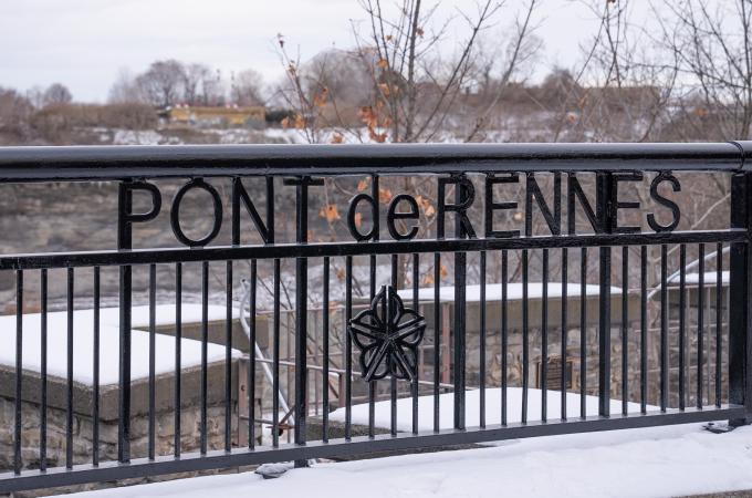 Photo of the Pont de Renne Bridge sign in downtown Rochester.