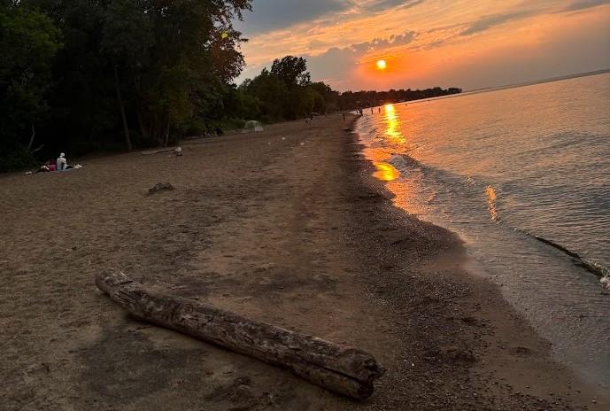 Photo of Durand Eastman Beach at sunset during summer 2024.