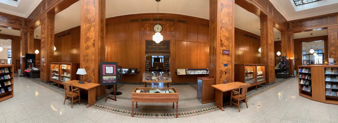 panoramic view of a wood paneled gallery space