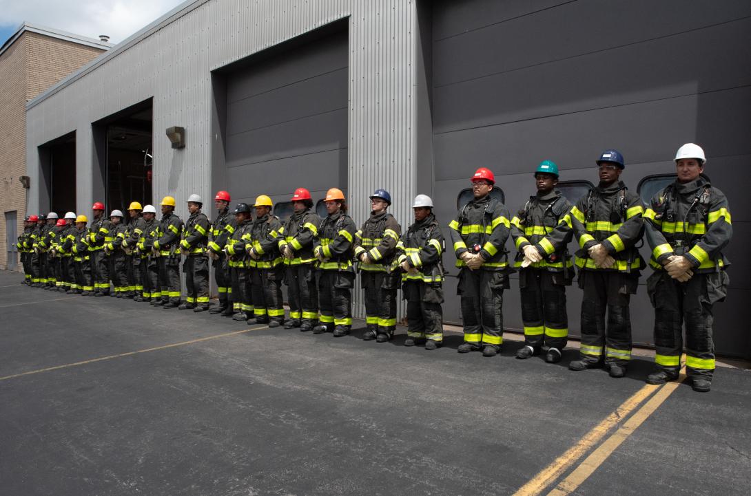 Photo of Rochster firefighters lined up for a drill.