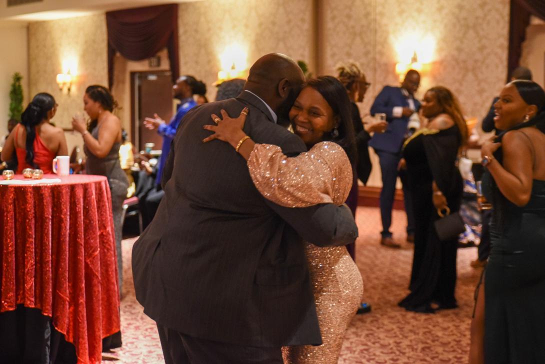 Photo of two people dancing happily in love at the 2023 Black Heritage Gala.